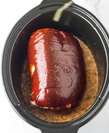 Slow Cooker Root Beer Pulled Pork in the slow cooker with bbq sauce