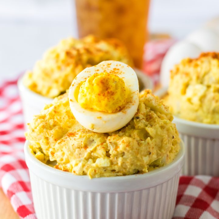 Deviled Egg Potato Salad in a bowl with a deviled egg on top