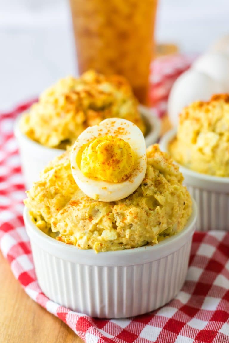Deviled Egg Potato Salad in a bowl with a deviled egg on top