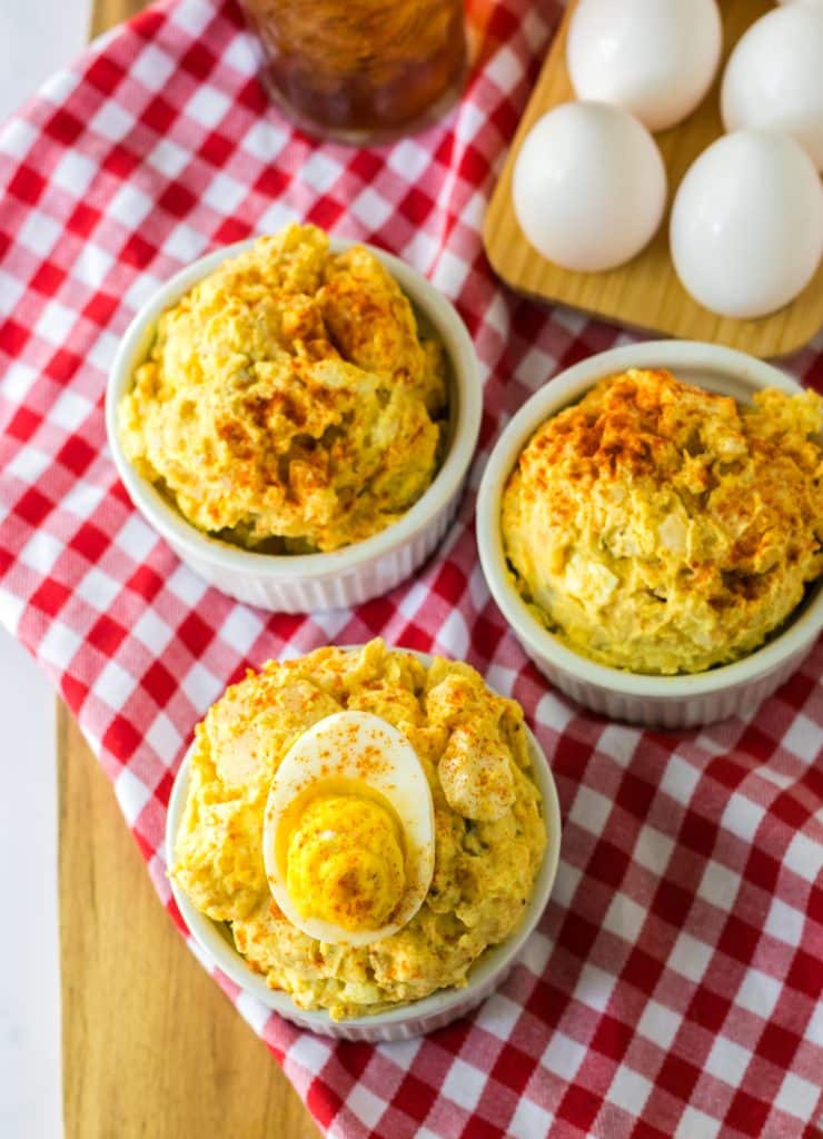 Deviled Egg Potato Salad in a bowl with a deviled egg on top