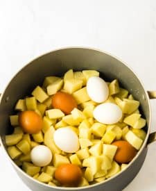 Deviled Egg Potato Salad potatoes and eggs in bowl