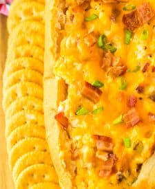 Mississippi Sin Dip on tray with crackers