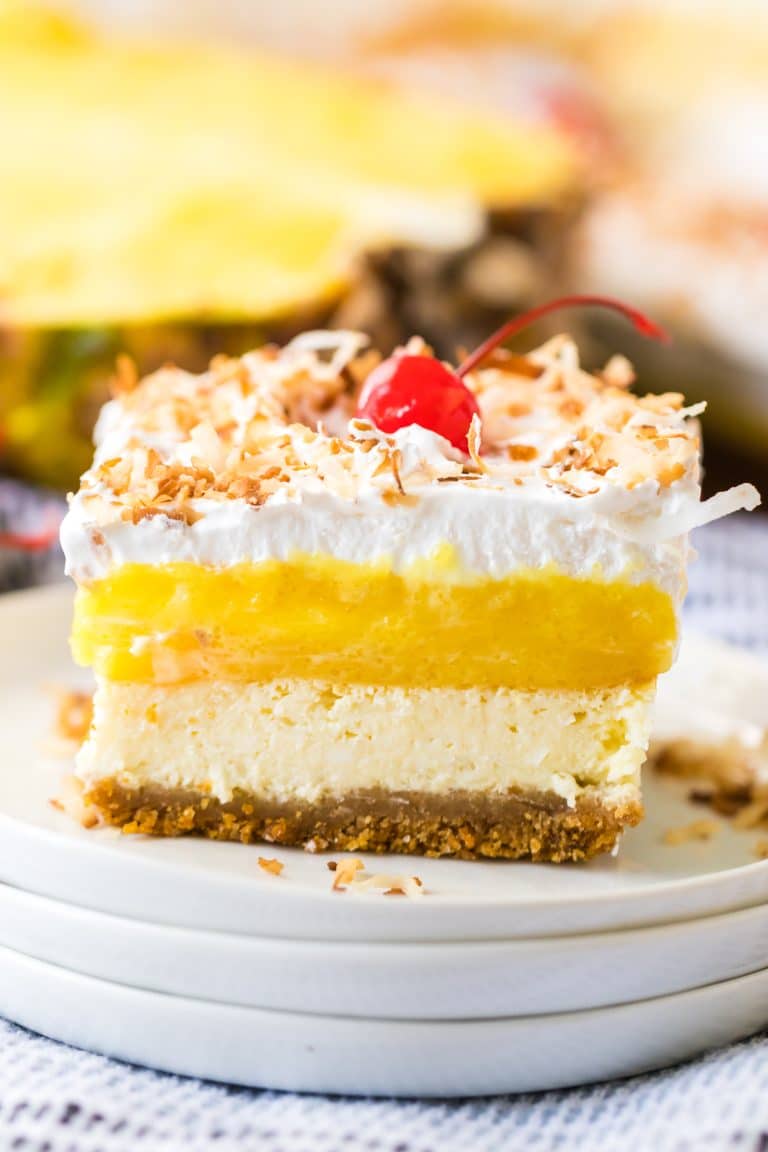 Pina Colada Cheesecake Bars sliced on a plate