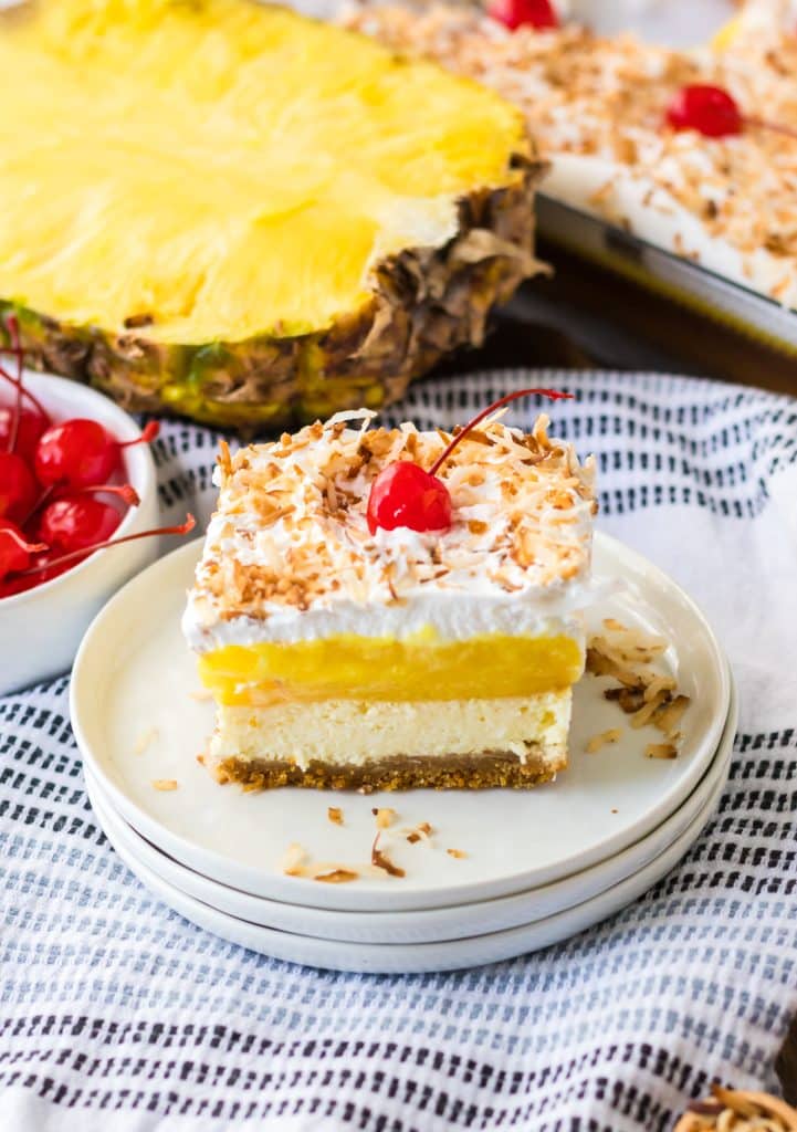 Pina Colada Cheesecake Bars sliced on a plate