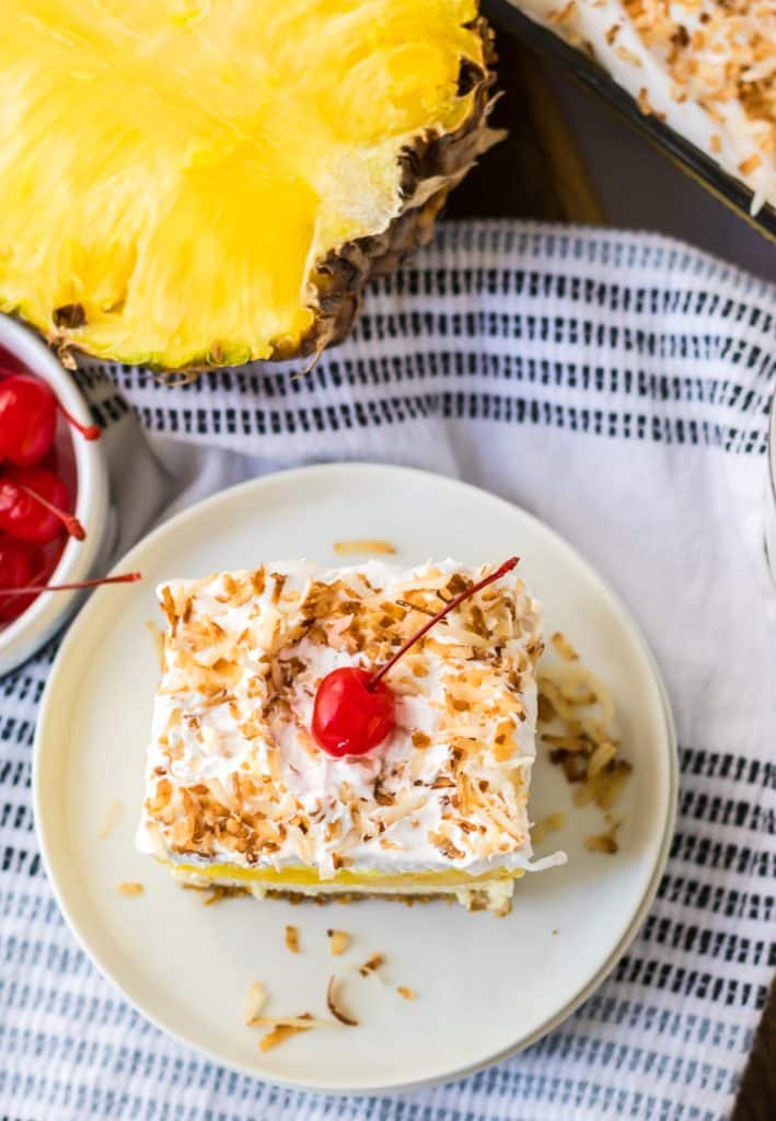 Pina Colada Cheesecake Bars sliced on a plate