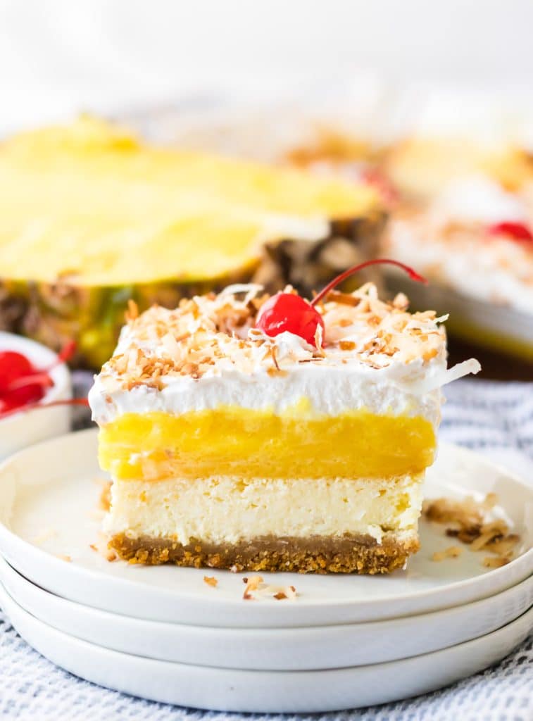 Pina Colada Cheesecake Bars sliced on a plate