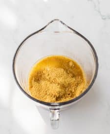 Pina Colada Cheesecake Bars crust ingredients in bowl