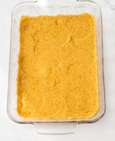 Pina Colada Cheesecake Bars crust in pan