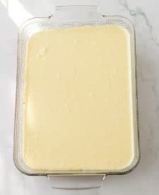 Pina Colada Cheesecake Bars filling in pan