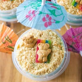 Sand Bucket Dessert over head shot with bear laying on candy towel