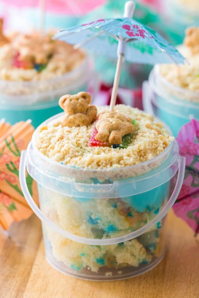 Sand Bucket Dessert over head shot with bear laying on candy towel