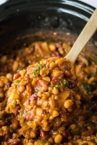 Slow Cooker Cowboy Beans in slow cooker in spoon
