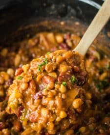 Slow Cooker Cowboy Beans in slow cooker in spoon