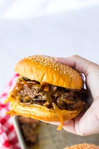 Slow Cooker Cowboy Beef Sandwiches in hand