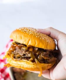 Slow Cooker Cowboy Beef Sandwiches in hand