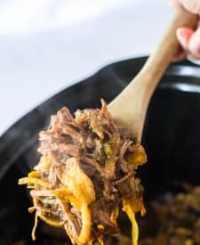 Slow Cooker Cowboy Beef Sandwiches in slow cooker in spoon