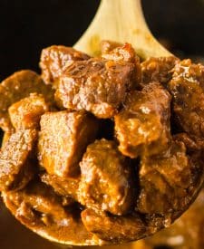 Slow Cooker Honey in spoon in slow cooker