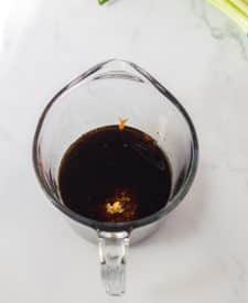 Slow Cooker Honey in spoon in sauce