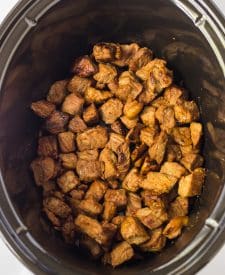 Slow Cooker Honey in spoon in slow cooker