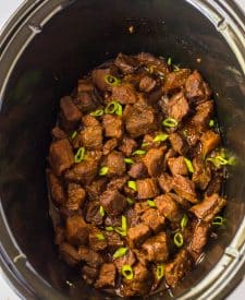 Slow Cooker Honey in spoon in slow cooker