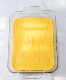 Ultimate Banana Pudding Poke Cake batter in pan