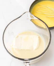 Ultimate Banana Pudding Poke Cake cream cheese in bowl