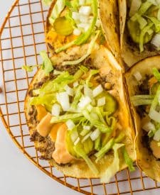 Close up of Big Mac Smash Tacos on a rack