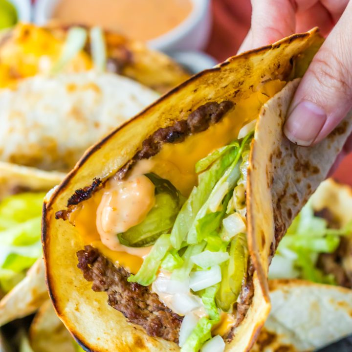 Big Mac Smash Tacos being held in hand