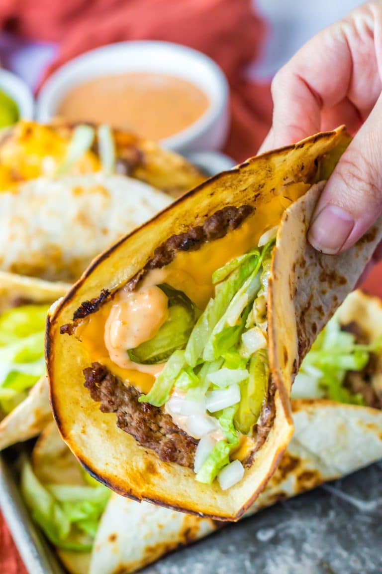 Big Mac Smash Tacos being held in hand