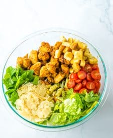Chicken Caesar Pasta Salad ingredients in bowl