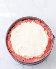 No Bake Strawberry Pretzel Pie in pan with cream topping