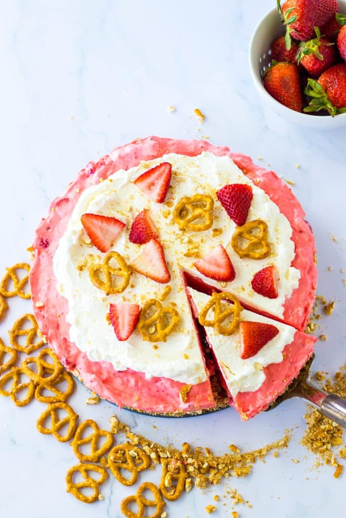 No Bake Strawberry Pretzel Pie with a slice coming out