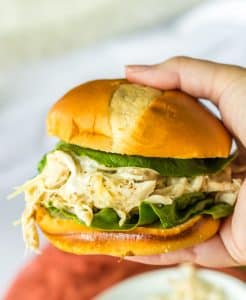Slow Cooker Chicken Caesar Sandwiches in hand