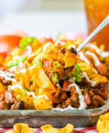 Slow Cooker Frito Pie plated in tray