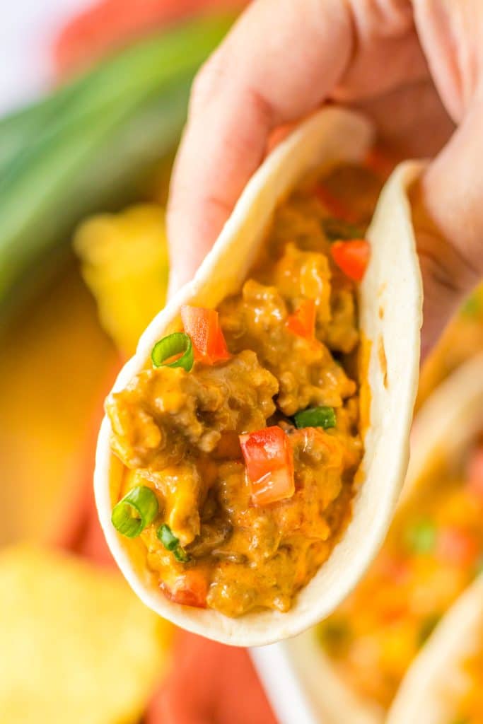 Slow Cooker Rotel Tacos being held in hand