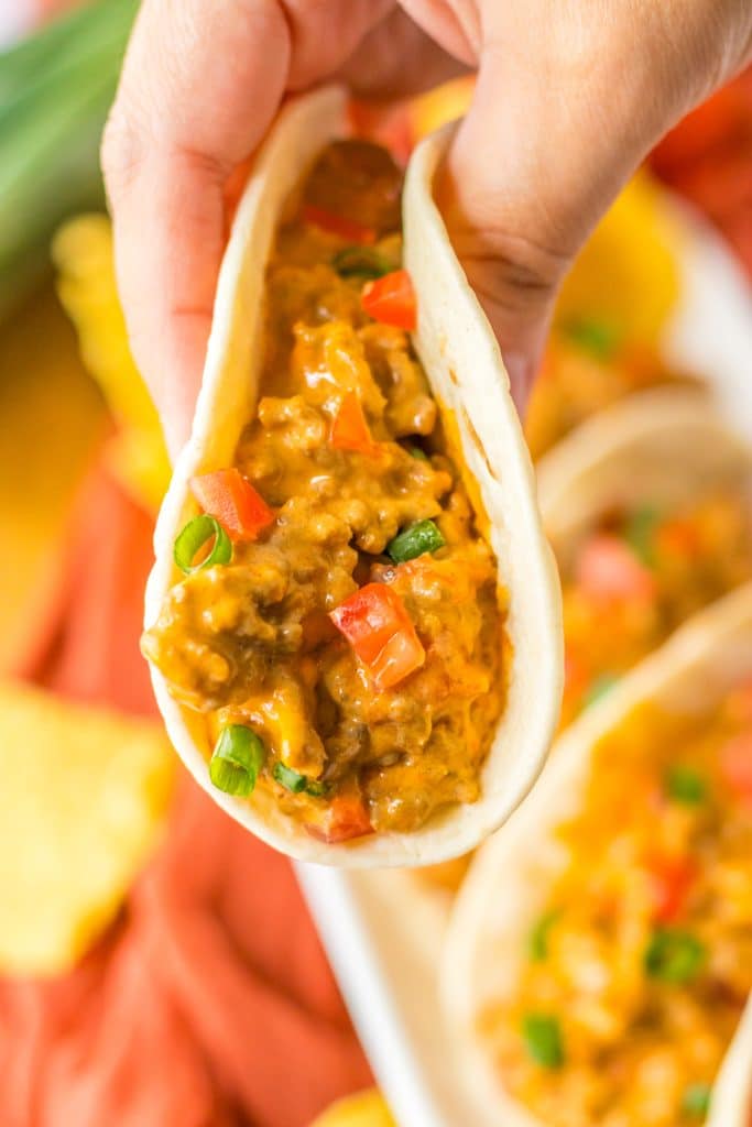 Slow Cooker Rotel Tacos being held in hand