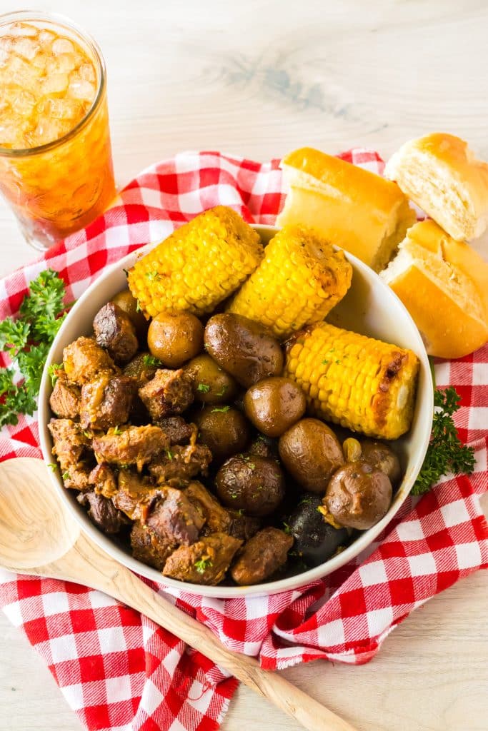 Slow Cooker Steak, Potatoes and Corn plated in bowl