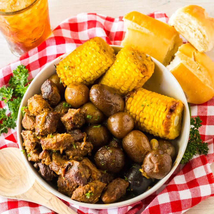 Slow Cooker Steak, Potatoes and Corn plated in bowl