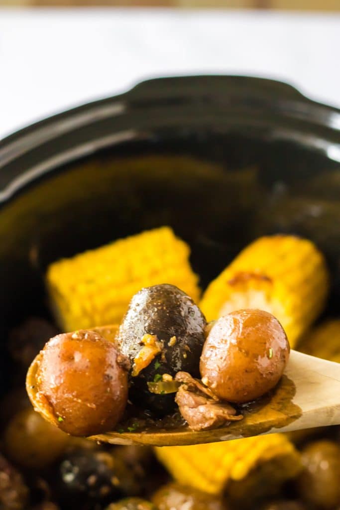Slow Cooker Steak, Potatoes and Corn in spoon