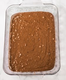 Almond Joy Poke Cake batter in pan