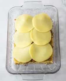 Philly Cheesesteak Sliders in pan with cheese