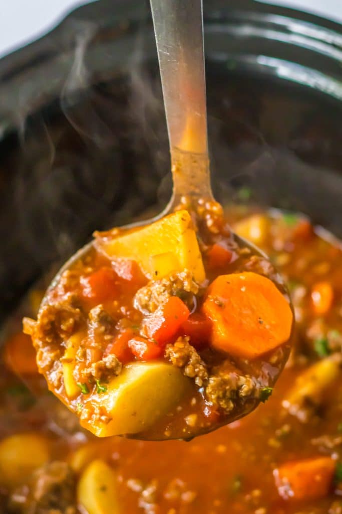 Slow Cooker Poor Mans Stew in spoon in slow cooker