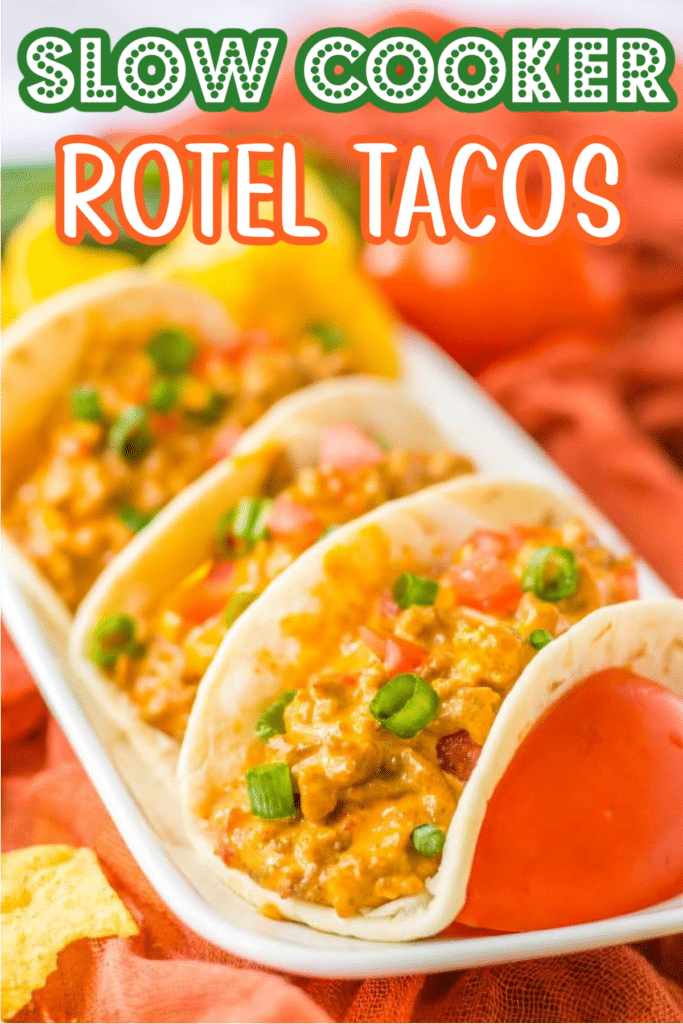 Three soft tacos filled with cheesy Rotel taco meat and topped with diced tomatoes and green onions.