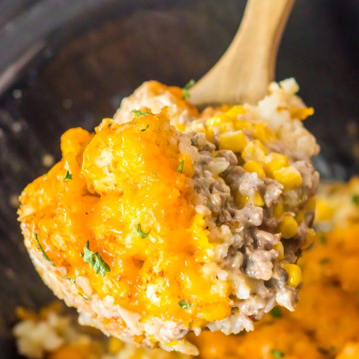 Slow Cooker Tatertot Casserole in spoon in slow cooker