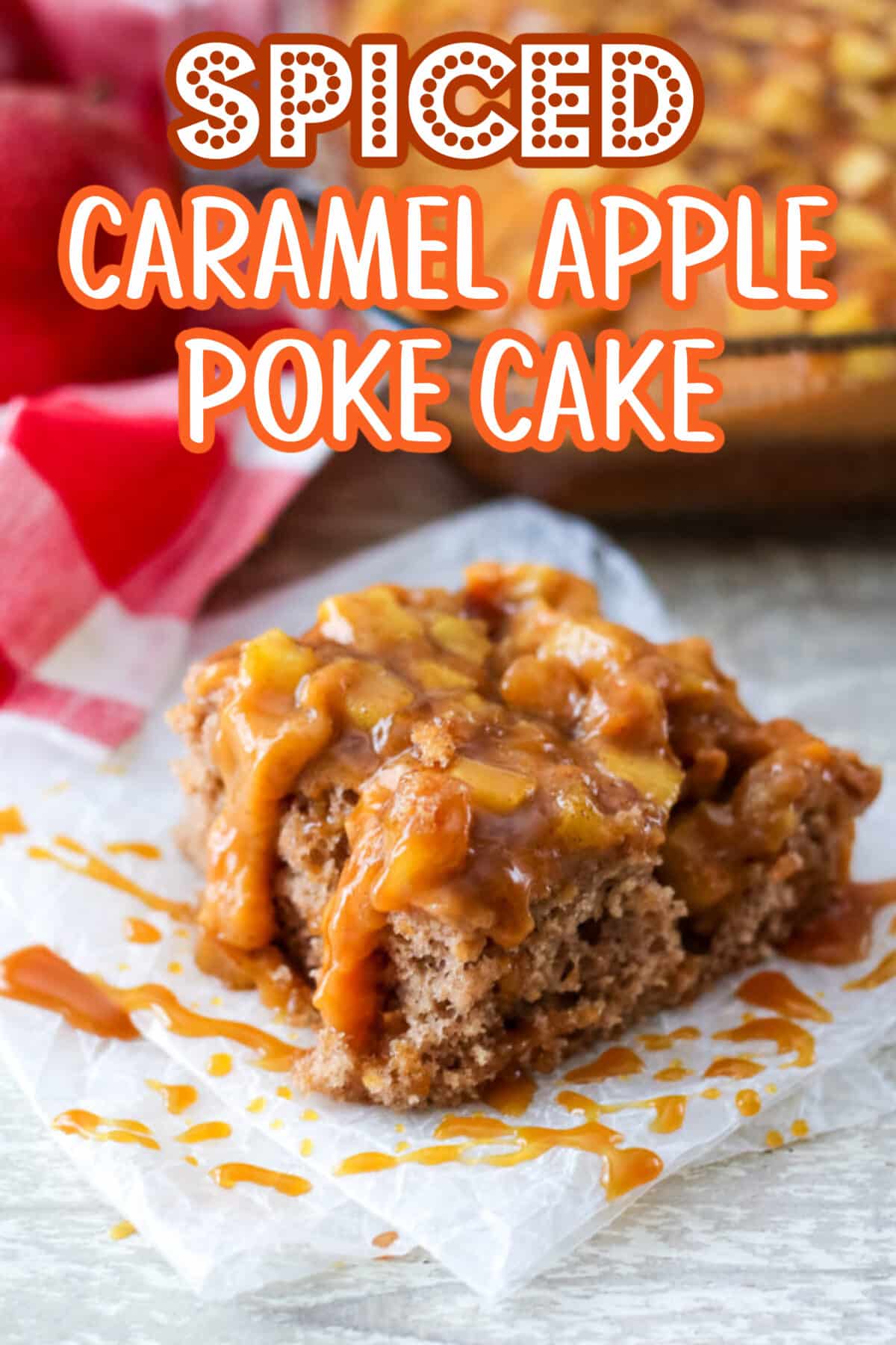 Moist slice of caramel apple poke cake with chunks of spiced apples and gooey caramel drizzle.