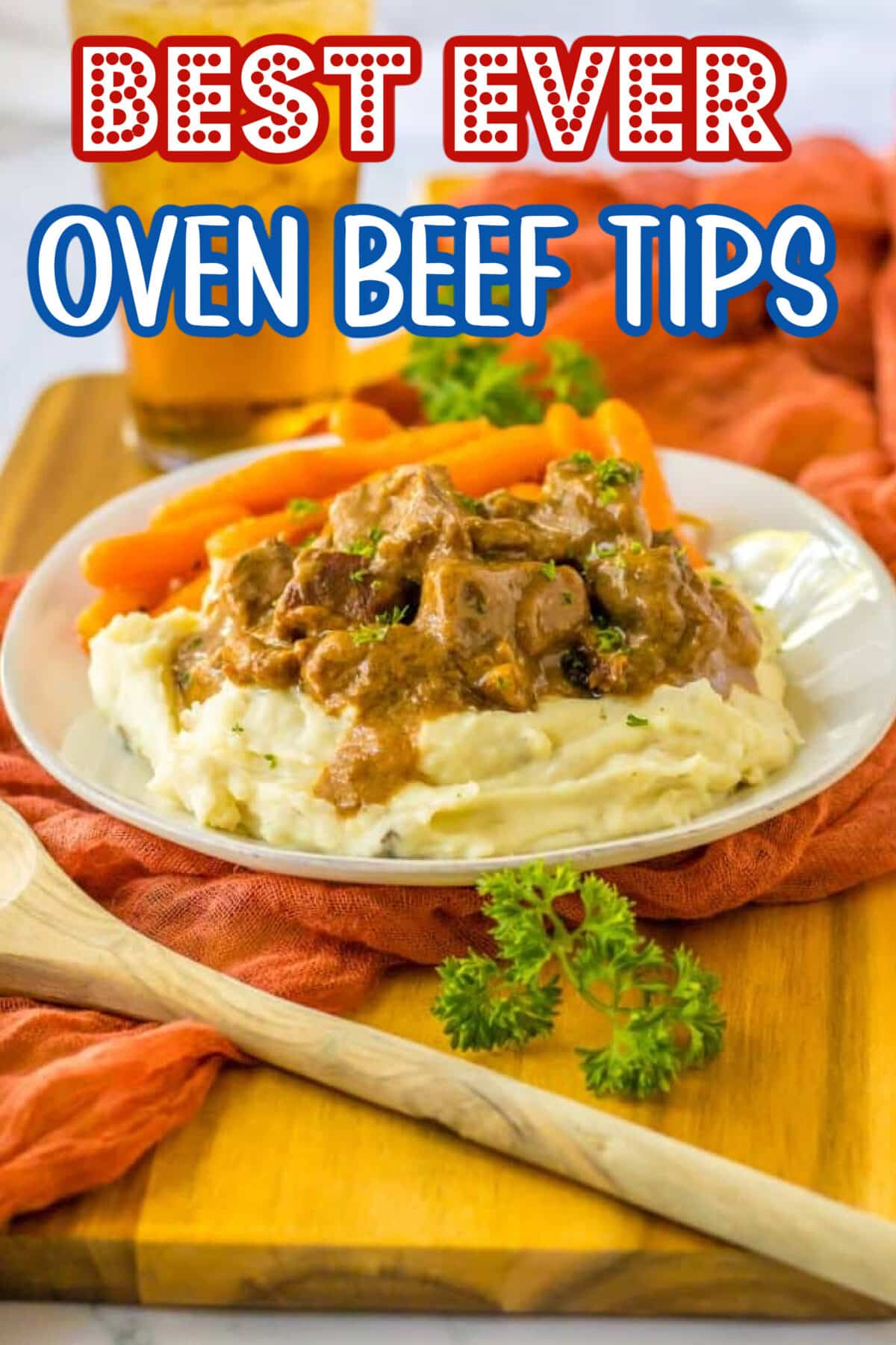 Oven-baked beef tips smothered in rich brown gravy served over mashed potatoes with carrots on the side.