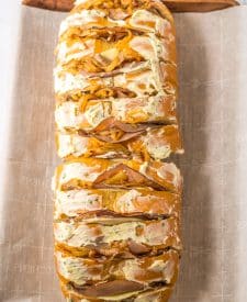 French Dip Pull Apart Bread spread with butter