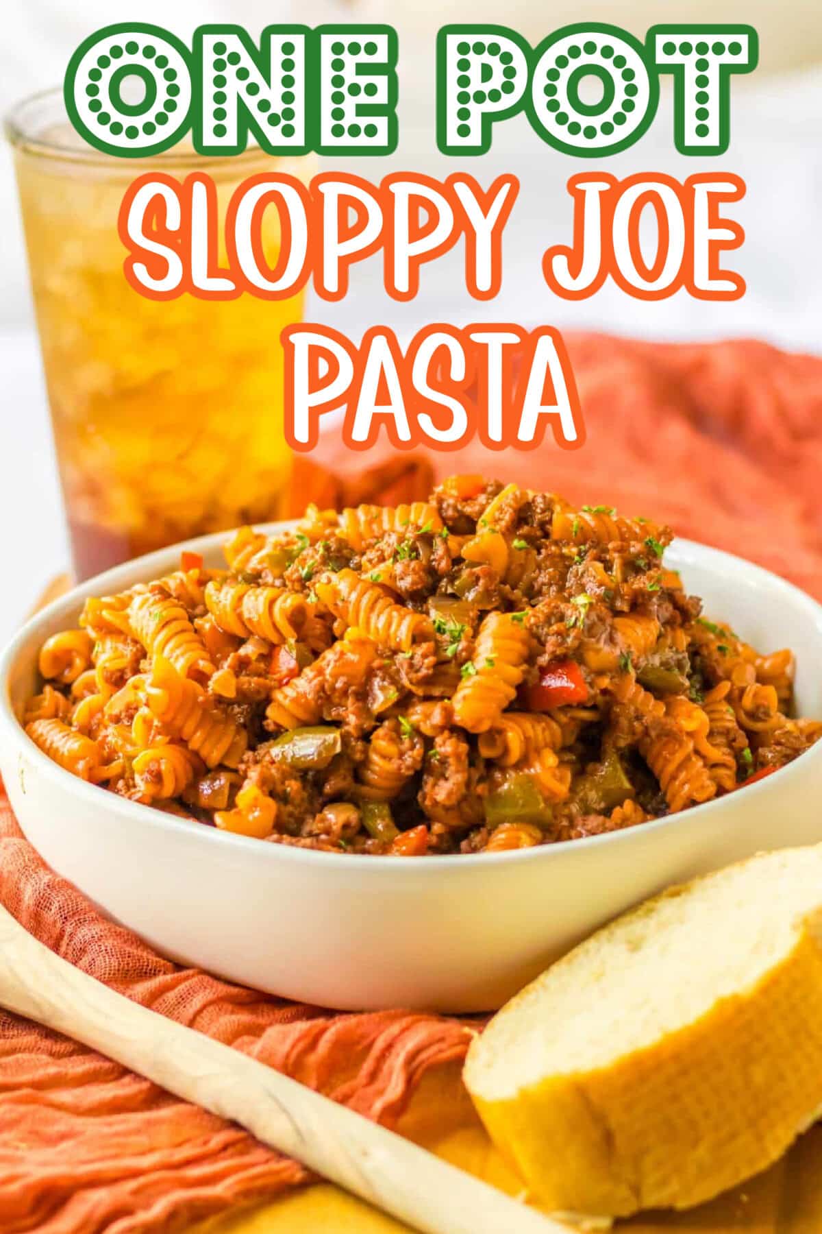 One Pot Sloppy Joe Pasta served in a white bowl with spiral pasta, ground beef, and peppers