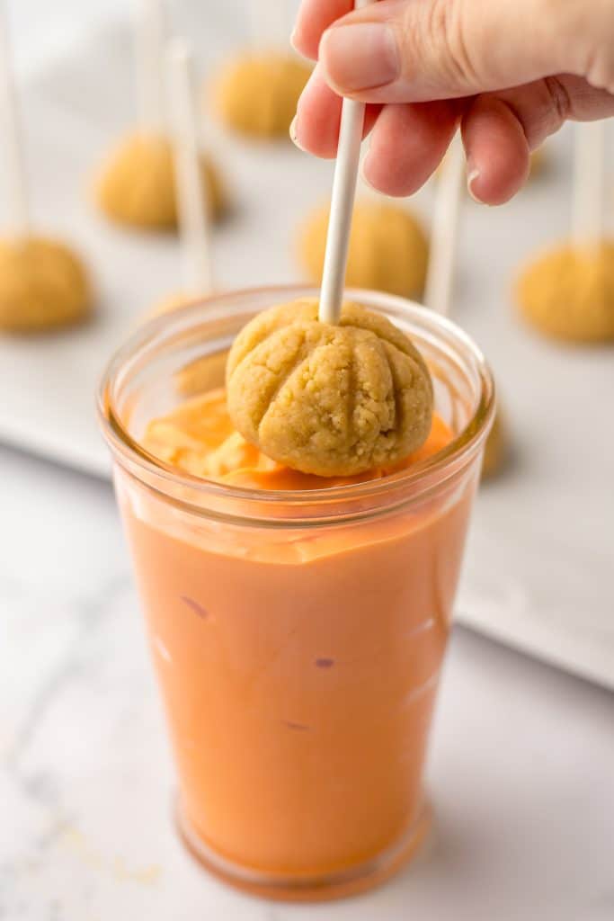 Pumpkin Cookie Truffles being dipped