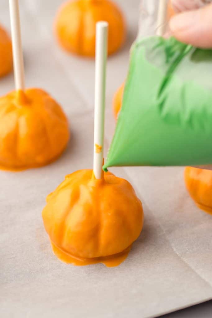 Pumpkin Cookie Truffles being decorated